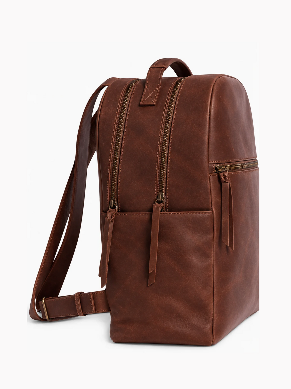 A brown leather backpack with multiple zippered compartments and a top handle, shown from a three-quarters angle against a white background. #Color_Bourbon