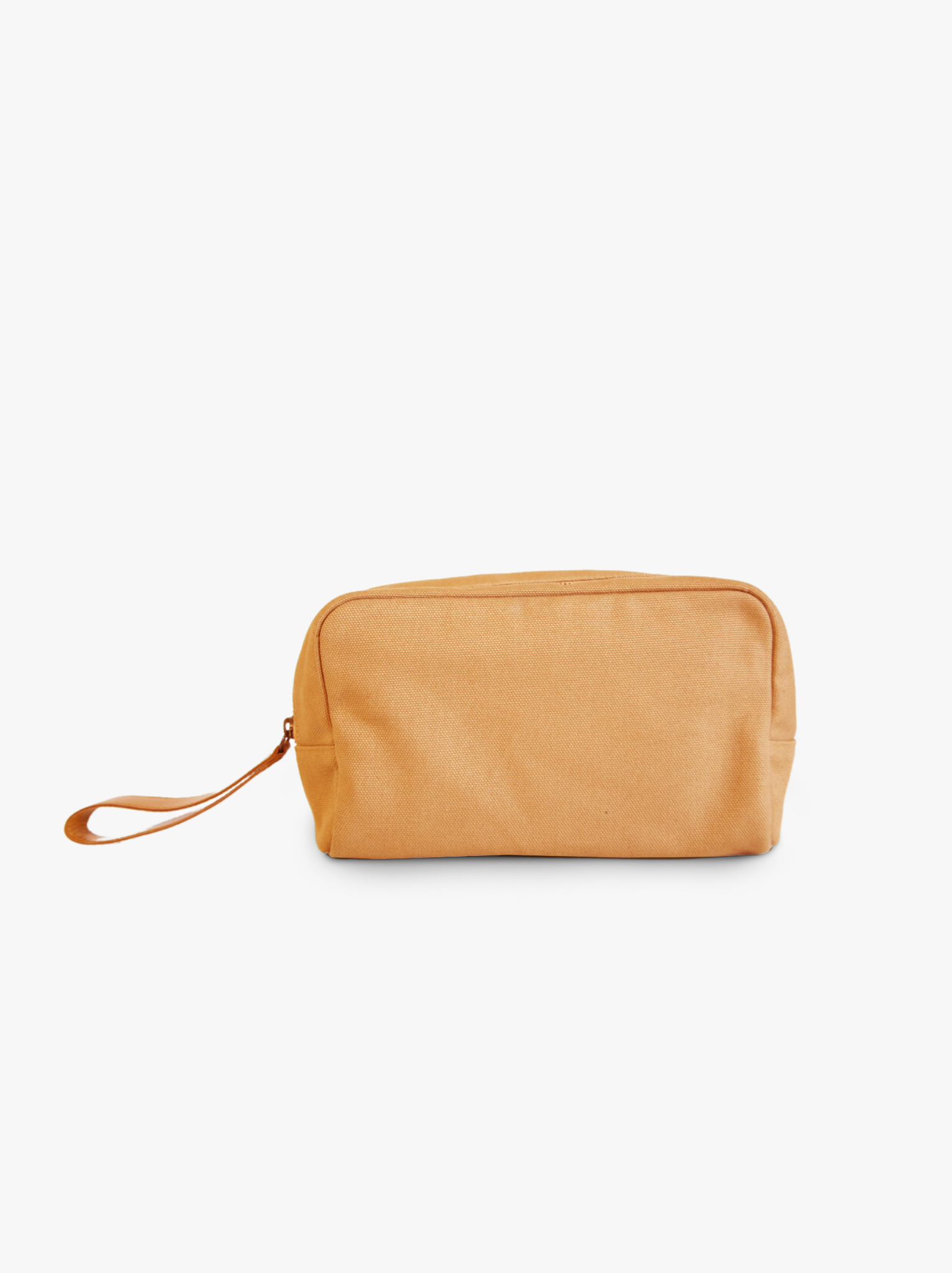 Tan canvas pouch with a cognac leather strap on a white background