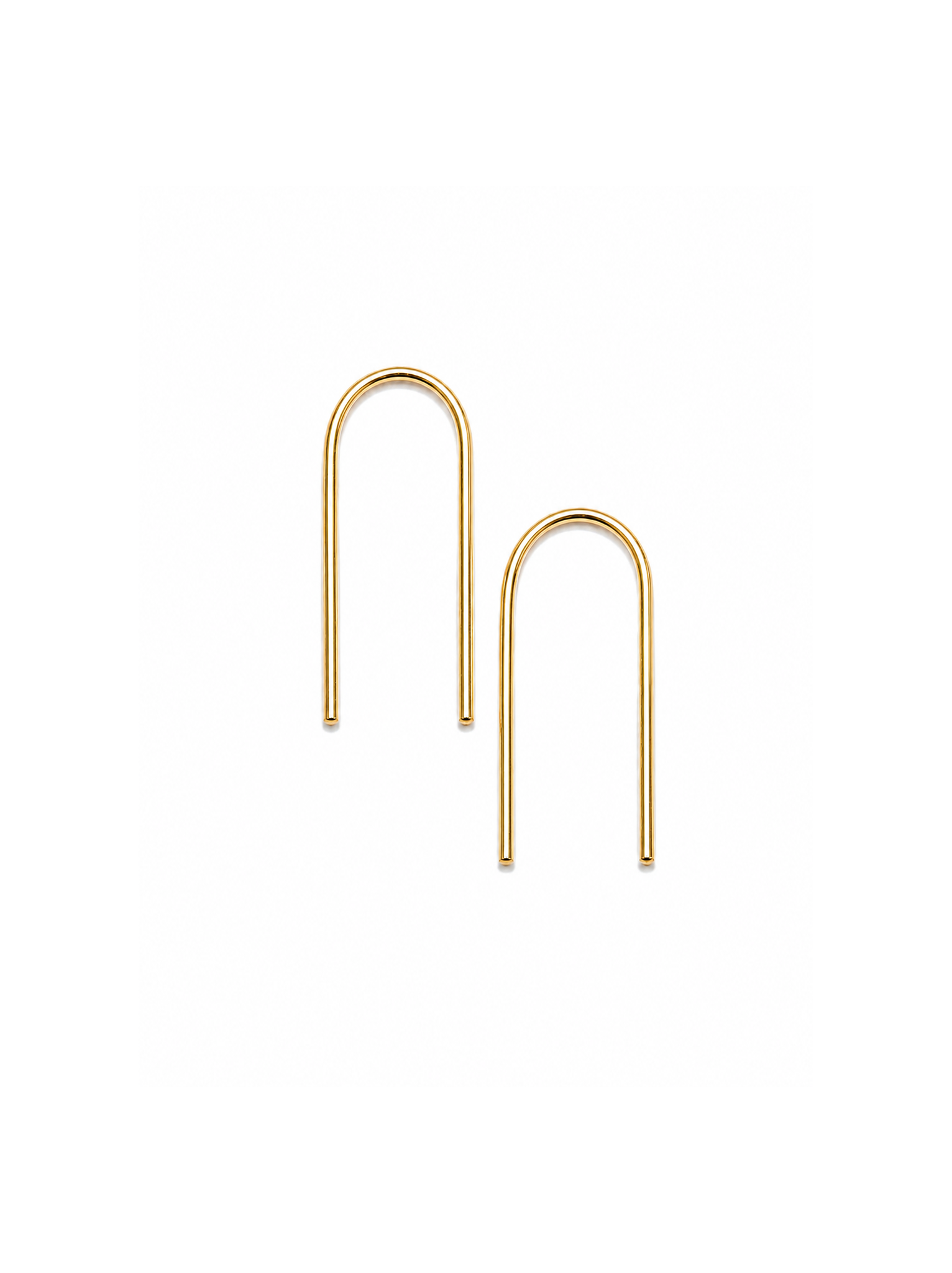 Gold upside down U-shaped earrings on a white background.