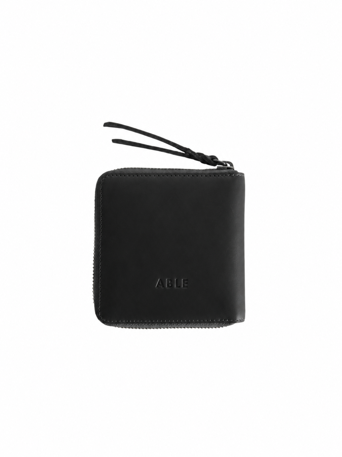 The back of a black leather zip-around wallet with a debossed 'ABLE' logo at the bottom center, shown on a plain white background. #Color_Black