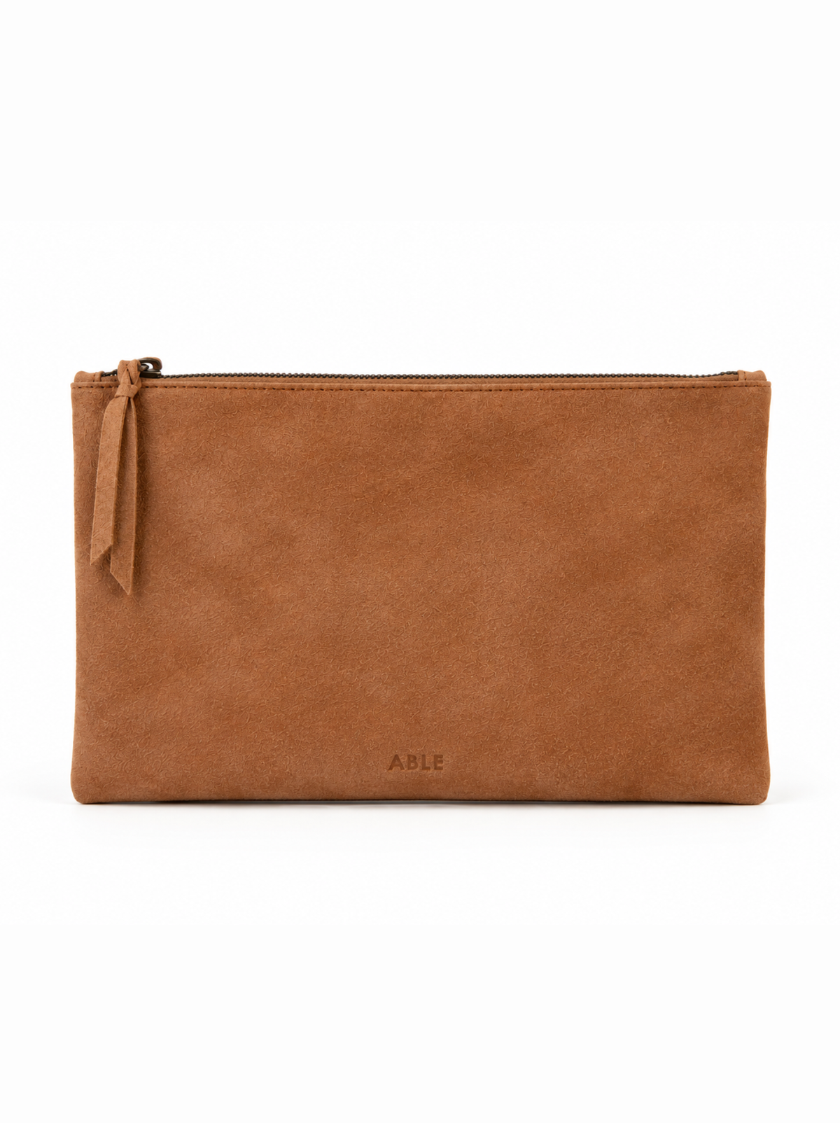 A tan suede zippered pouch with a small leather tag on the left side and the brand name 'ABLE' embossed near the bottom center, shown against a plain white background. #Color_Cognac Suede