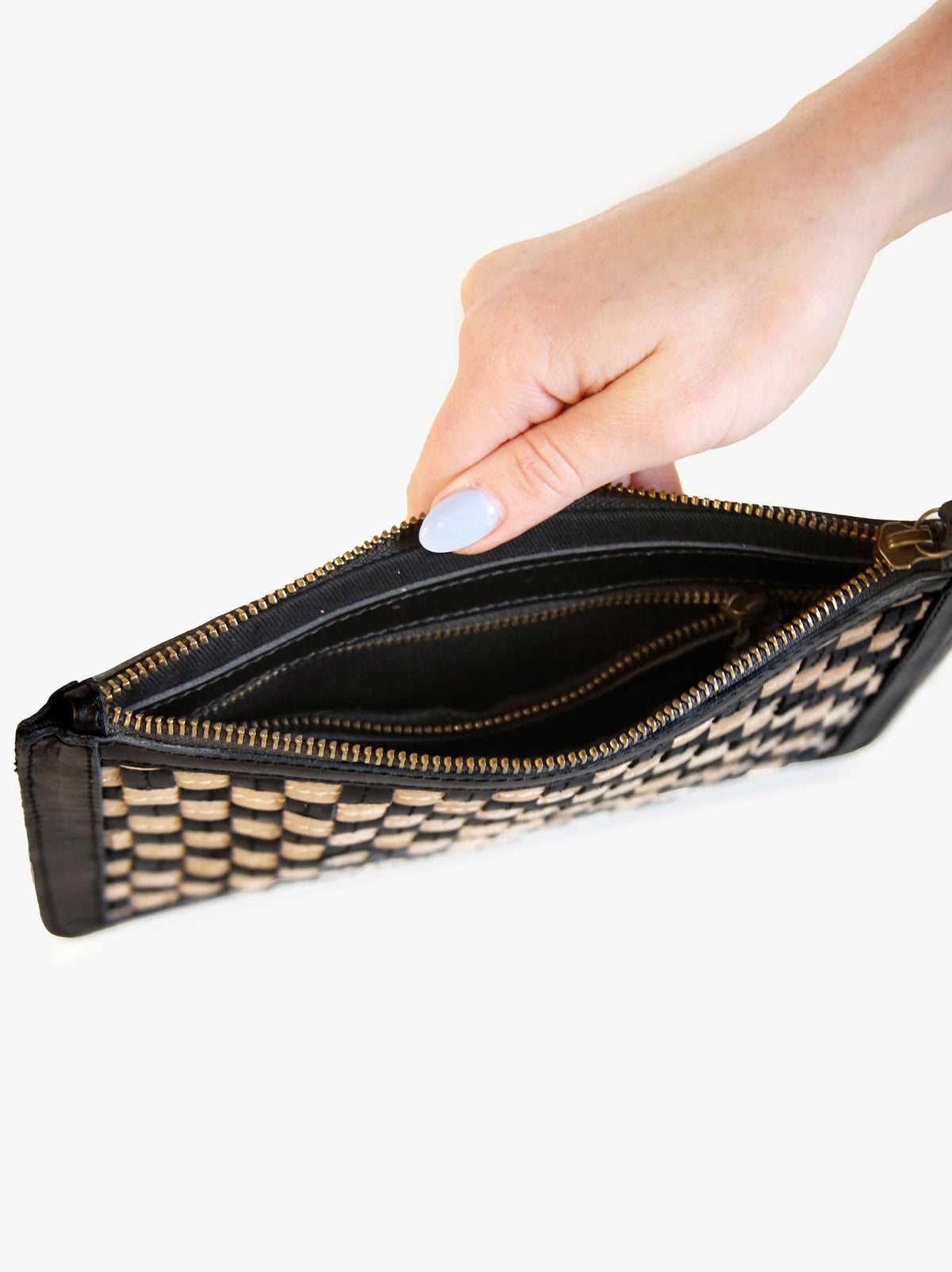 Lined interior of clutch with interior zipper pocket. #Color_Black/Tan