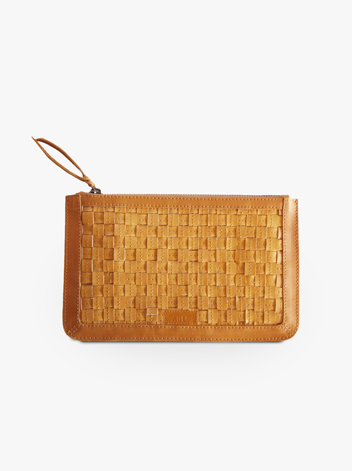 Back of brown basketweave clutch with brand logo on leather patch against a white background. #Color_Cognac