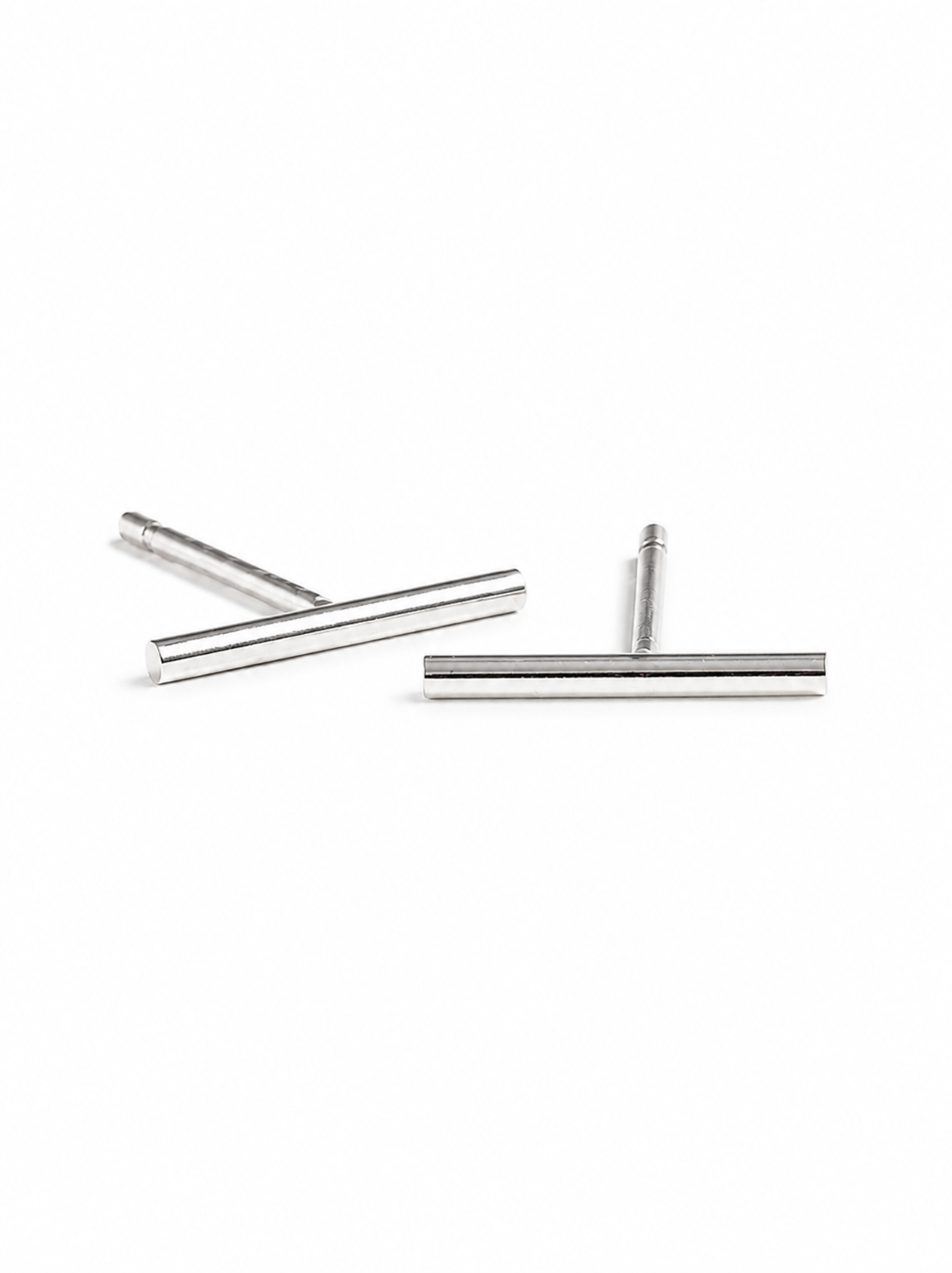 A pair of silver stick stud earrings on a white background. #Color_Sterling Silver
