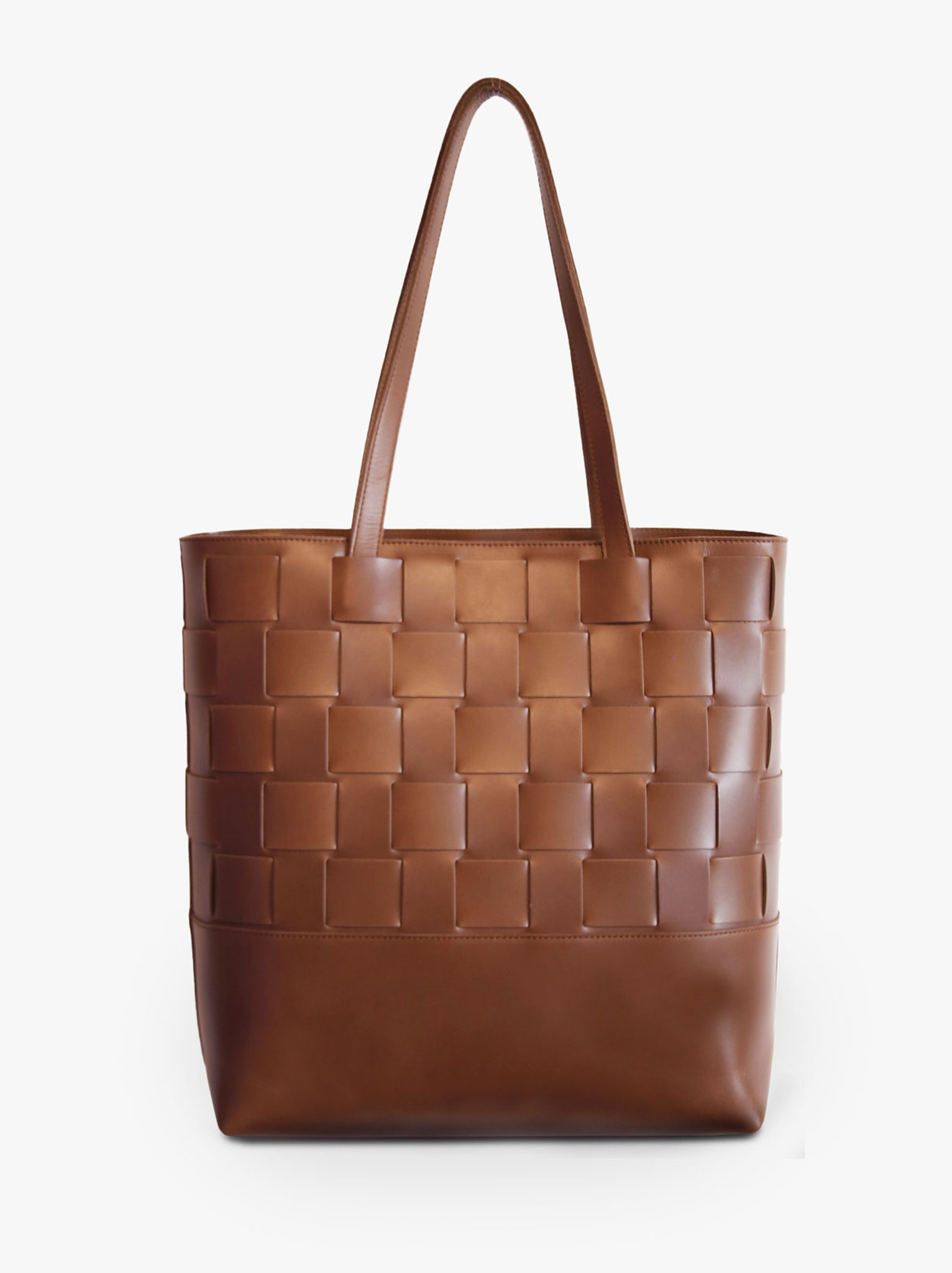 A brown woven tote bag made of leather, with a solid pattern and two handles. #Color_Whiskey