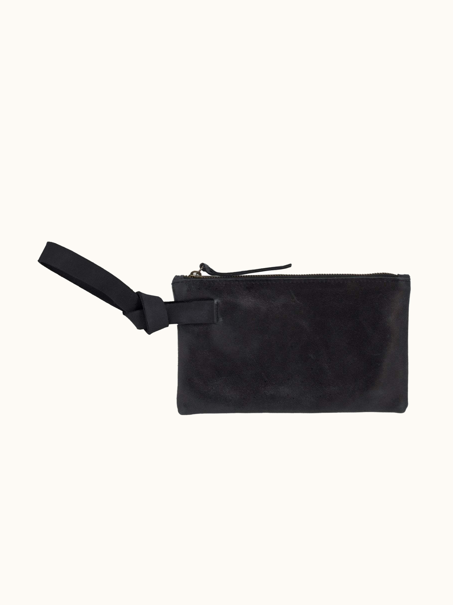 Black leather wristlet with leather zipper pull and handle on white background. #Color_Black