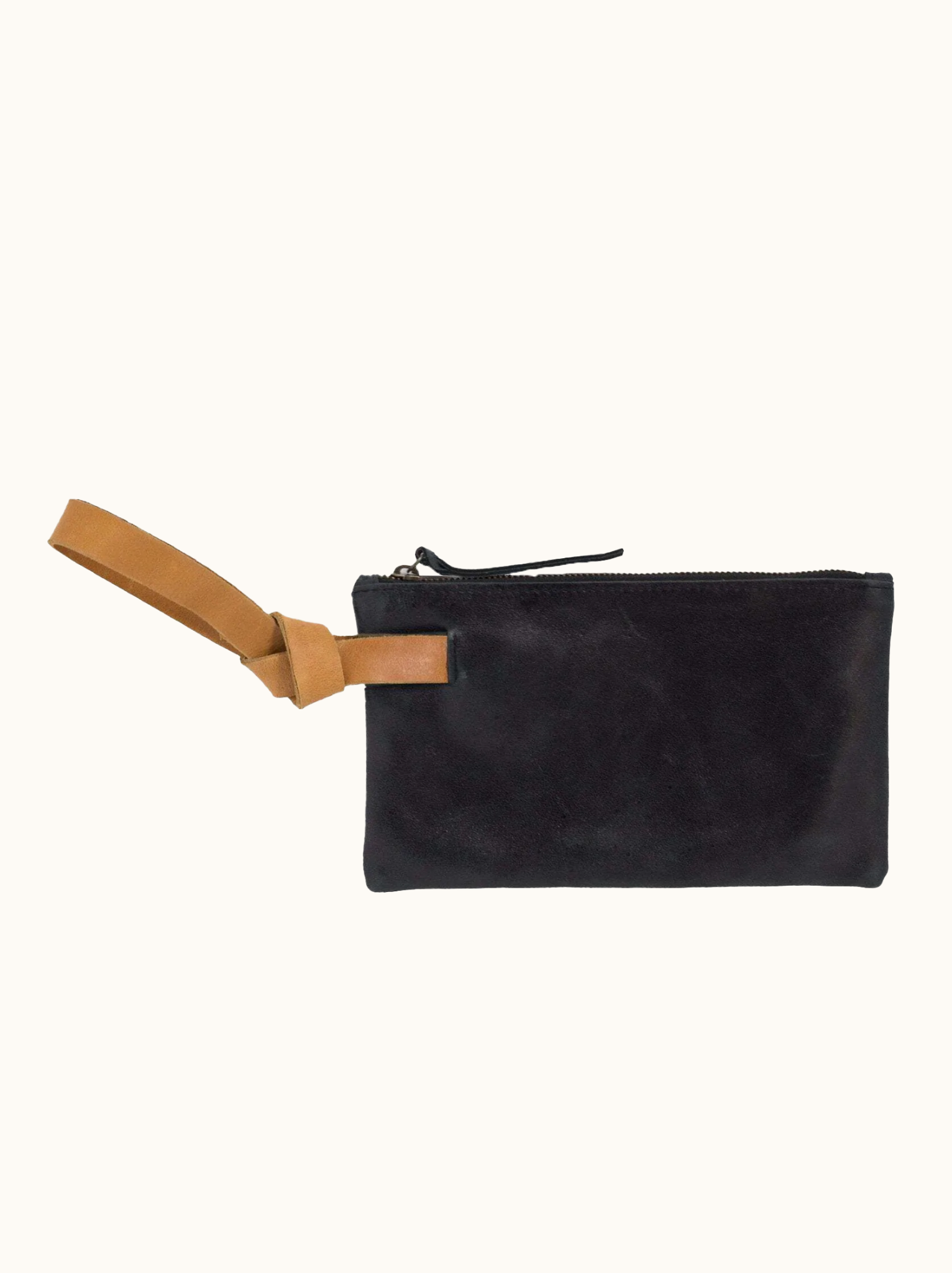 Black leather wristlet with orange cognac leather handle on white background. #Color_Black/Cognac