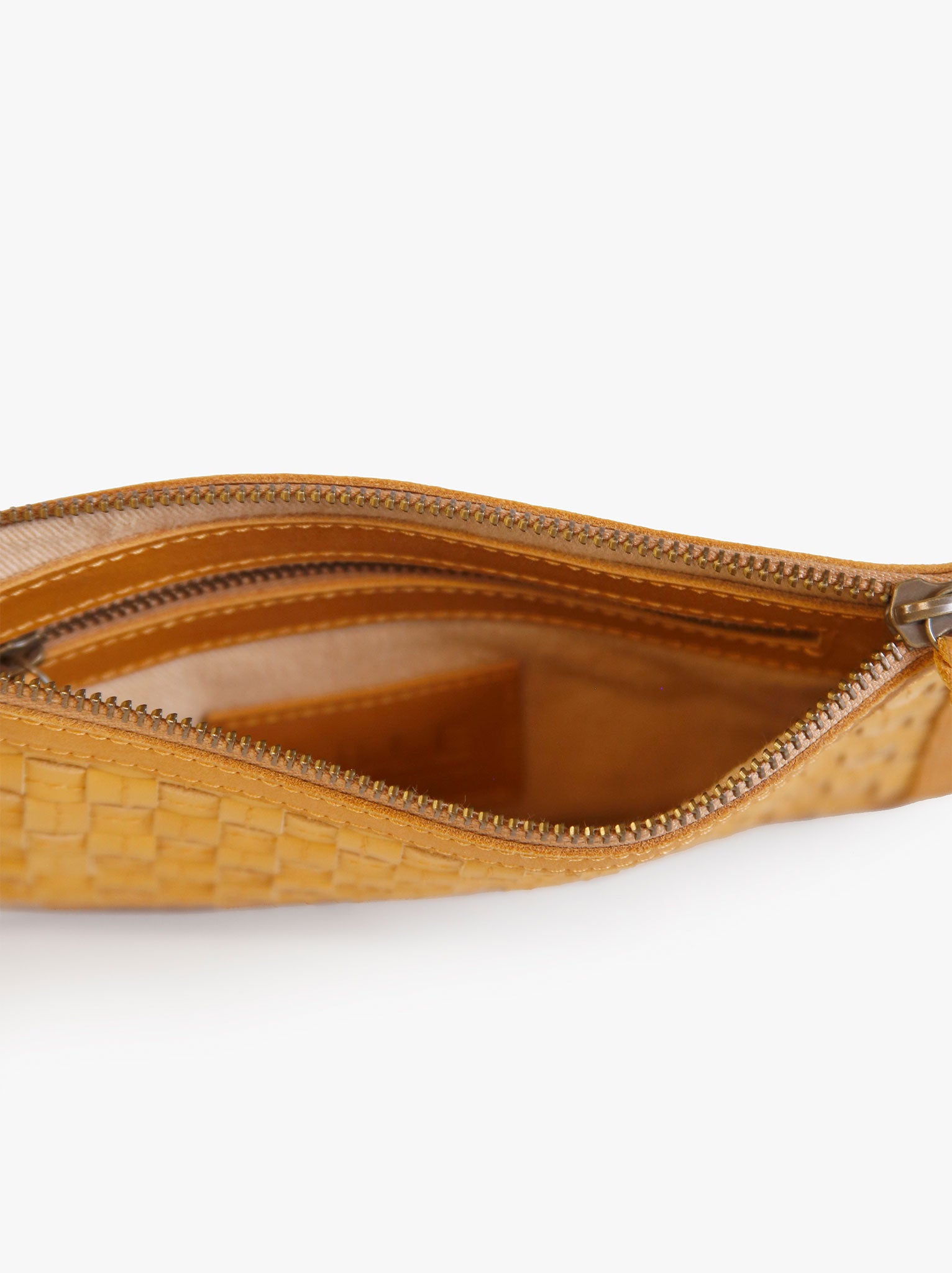 Lined interior of brown clutch with interior zipper pocket. #Color_Cognac